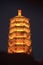 Golden Illuminated Pagoda at night. Guilin, Guangxi, China. October 29, 2018.