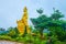 Golden image in garden, Big Buddha Temple, Chalong, Phuket, Thailand