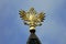 Golden Imperial Russian double-headed eagle topping the steeple of the Wooden Palace in Kolomenskoye