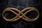 a golden infinity symbol on a black marble background