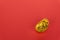 Golden Ingot On Red Background With Copy Space