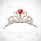 Golden jewelry tiara with diamonds and faceted red stone in a heart shape