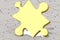 Golden jigsaw puzzle piece highlighted