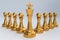 Golden King with golden pawns - chess teamwork concept