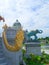 Golden King if Naga and Elephant sculpture at Ruen Yod Barom Mungkalanusaranee pavilion under bright blue sky