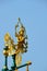 Golden Kinnaree lamp on blue sky background of thai temple in Ang Thong