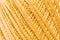 Golden knitting thread texture, handiwork backdrop