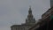 A golden lady justice statue sits atop a castle-like New York court building