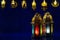 Golden lanterns put on dark blue background with decorated lights