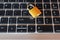 Golden locked padlock on laptop keyboard