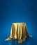 Golden luxurious fabric or cloth placed on top pedestal or blank podium shelf on blue background with luxury concept. Museum or