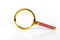 Golden magnifier on white paper background