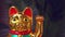 Golden maneki-neko cat waves paw souvenir for good luck, talisman of happiness