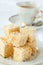 Golden marshmallow cubes with coconut bits