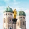 The Golden Mary\'s Column opposite the towers of the Cathedral of Our Dear Lady in Munich, Germany