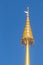 Golden metal chatra on the top of the church in Buddhist temple in Northern Thailand. It is an auspicious symbol in Hinduism and B