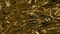 Golden metal foil, wrinkled and shiny. Close-up, abstract image background