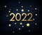 Golden metallic 2022 sign with stars confetti