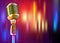 Golden microphone on a bright multi-colored background