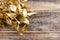 Golden mistletoe on wooden background