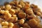 Golden mixed nuts, snacks, chips for beer close-up with selective focus