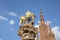 Golden Nassau Lion on Marktbrunnen in Wiesbaden with top of Marktkirche - market church