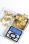 Golden nugget found by amateur prospector weighted on digital scale