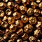 Golden nuggets on dark background, raw precious gold