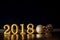 Golden Number 2018 placed on dark elegant glamour night tone background for new year 2018 celebration concept