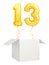 Golden number thirteen balloon flying out of blank white box isolated on white background