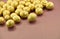 Golden Nuts on Brown Background