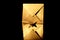 Golden origami boat with envelope on black background