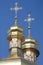 Golden orthodox cathedral cupolas with crosses