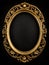 golden oval vintage frame isolated on black background with clipping paths. Gold frame on a wooden background. Gold oval frame on