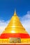 Golden pagoda with blue sky day and thai wording