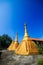 Golden pagoda detail is `Mon` architectural style at temple located in Kanchanaburi Province, Thailand