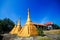 Golden pagoda detail is `Mon` architectural style at temple located in Kanchanaburi Province, Thailand