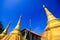 Golden pagoda detail is `Mon` architectural style at temple located in Kanchanaburi Province, Thailand