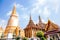 Golden pagoda and halls buildings at Emerald Buddha temple or Wa