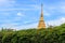 Golden Pagoda with tree and blue sky, Wat Phra Thad Chang Kham,