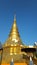 Golden pagoda under the blue sky.