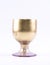 Golden painted, elegant glass on a white background
