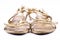 Golden painted, elegant, party shoes on a white background - front