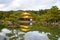 Golden Pavilion with reflections on water in autumn season, back