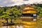 Golden Pavilion temple in Kyoto standing in the water and surrounding gardens