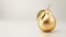 Golden pear made of gold on a white background, suitable for minimalist design or premium product illustration