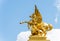 Golden pegasus statue at the Pont Alexander III bridge, Paris, a deck arch bridge that spans the Seine in Paris, France