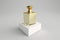 Golden perfume bottle on white podium, minimalist fragrance perfume mock up style. Cosmetics and beauty sphere