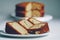 Golden pieces of banana cake on white plate on table