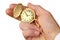 Golden pocket watch in a businessman\'s hand.